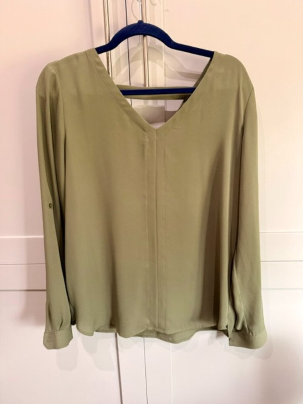 This sage green LOFT Outlet top features a classic crew neckline